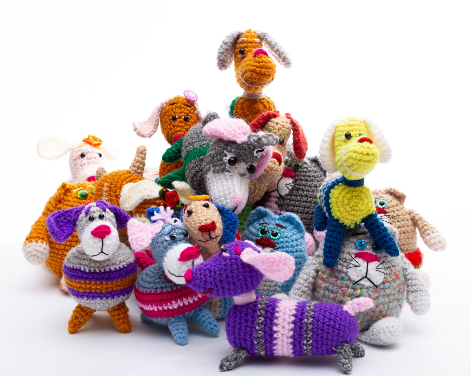 A vibrant collection of handmade crochet animal toys in a playful arrangement.