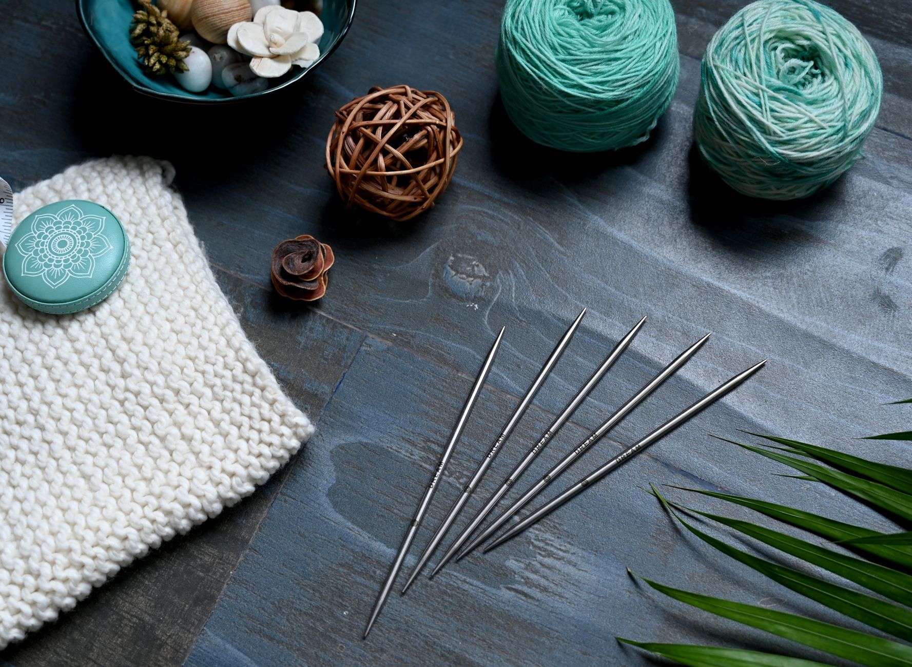 Flat lay of knitting tools and yarn for crafting projects. Perfect for knitters and hobbyists.